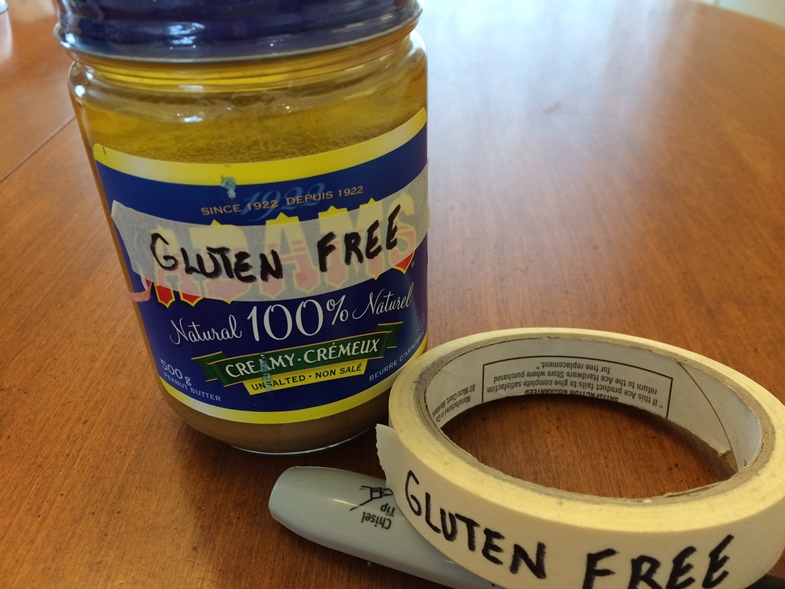  Labelling gluten-free items. Shows a condiment and masking tape and pen. 